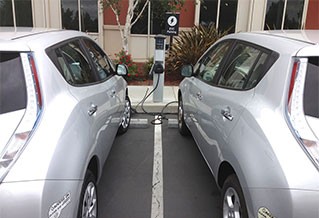 Photo of two electric cars charging